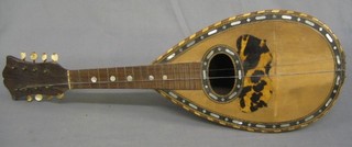 A 8 stringed mandolin, label inside marked Alfonso Moretti imported by Ball Bealvon & Co London