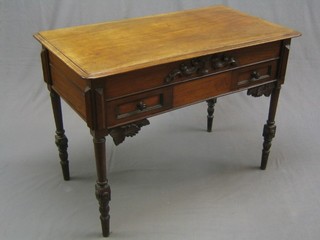 A Victorian carved oak side table fitted 2 short drawers, raised on turned and block supports 42"