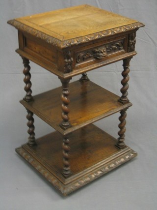 A Victorian carved oak 3 tier bedside cabinet fitted a drawer and raised on spiral turned supports 19"