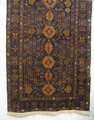 A contemporary Afghan Belouch rug with blue border and geometric all over design 80" x 45"