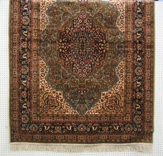 A contemporary green ground and floral pattern Persian design Madras cotton rug with central medallion 66" x 49"