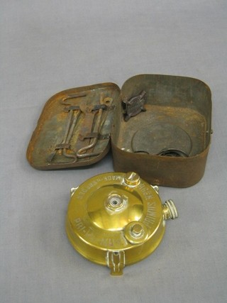 A brass pocket primus stove
