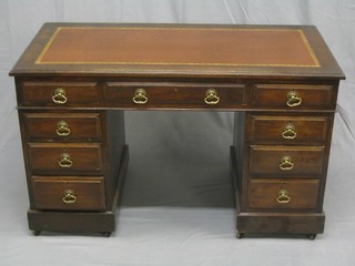 A Victorian oak kneehole pedestal desk with inset tooled leather writing surface above 9 drawers, 48"