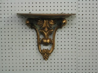 A carved gilt wood wall bracket