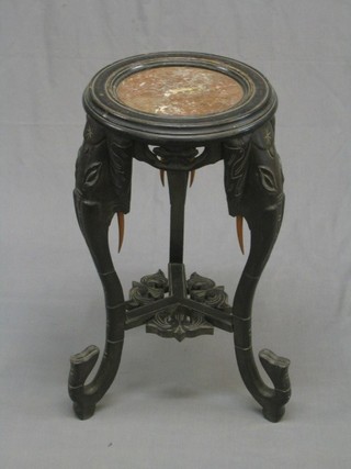 A Victorian ebony and marble jardiniere stand, raised on elephant supports