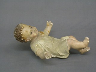 A 19th Century plaster crib model of the baby Christ, the reverse incised LS3, (fingers chipped, feet chipped, some damage)