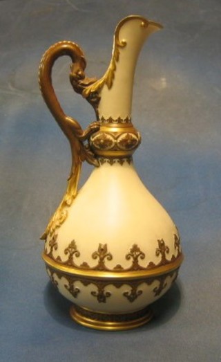 A fine quality Victorian Royal Worcester jug, the handle in the form of a mythical beast, base with green Worcester mark and impressed Worcester mark, 782 (large crack to base) 15"