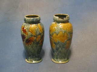 A pair of Royal Doulton salt glazed club shaped vases with blue ground and Autumnal decoration, bases marked Royal Doulton and impressed 3461 incised MB (1 heavily damaged and repaired, 1 chipped to base) 6"
