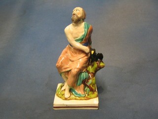 An 18th Century Staffordshire figure of Elijah and the raven (r) 9"