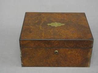 A Victorian figured walnut writing slope with hinged lid (interior requires some attention) 12"