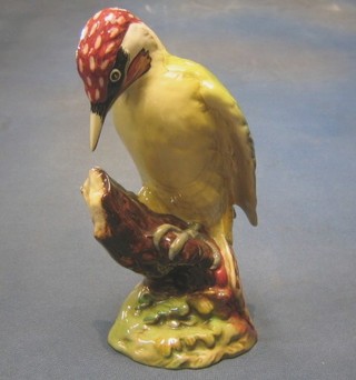 A Beswick figure of a spotted woodpecker, the base marked 218 9"