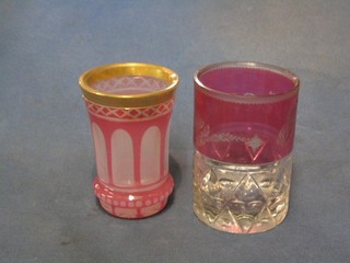 A 19th Century Bohemian pink etched glass beaker with gilt banding 4 1/2" together with a Bohemian pink and clear cut glass beaker 5"
