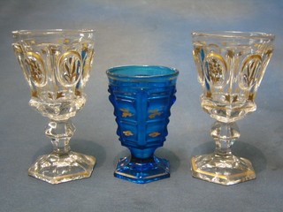 A 19th Century Bohemian blue glass vases of tapering form with  gilt and panelled decoration together with 2 circular Bohemian glasses with gilt decoration, raised on octagonal feet