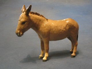 A Beswick figure of a standing donkey, the base marked Beswick England 4"