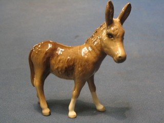 A Beswick figure of a standing donkey foal 3 1/2"