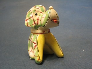 A 1950's pottery figure of a seated dog, base marked Foreign 5"