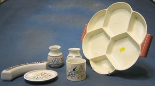 A Poole Pottery twin tone 6 section hors d'eouvres dish, 2 circular Poole Pottery baluster shaped vases with floral decoration 3" (1 chipped), a Poole Pottery vase 3", a plate 5" and a crescent shaped flower vase 8"