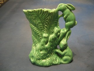 A Sylvac green glazed vase, the handle in the form of 2 rabbits, base marked Sylvac 1318 8"