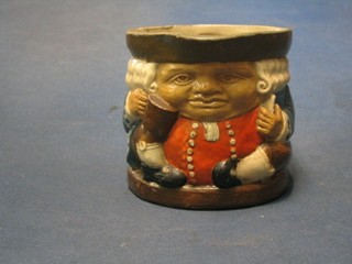 A Doulton Toby jug of seated Toby Philpot with tankard, base marked Doulton and incised 85 88 4"