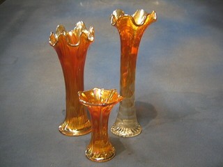 3 graduated Carnival glass vases