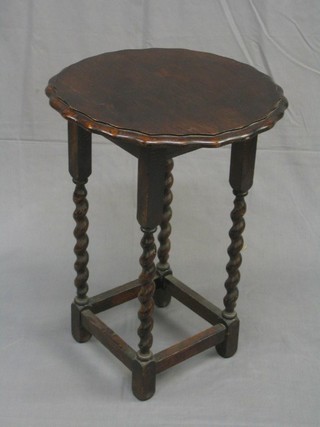 A circular Art Deco occasional table with pie crust edge, raised on spiral turned and block supports (cut down) 18"