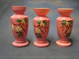 A pair of Victorian pink opaque glass vases 9" with floral decoration and 1 other (3)