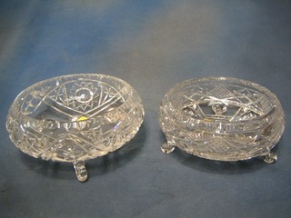 A circular cut glass bowl raised on 3 scrolled supports 8" and 1 other