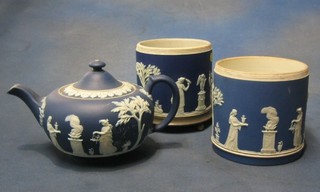 A Wedgwood blue Jasperware teapot, the base marked Wedgwood England and 2 cylindrical biscuit barrels (no mounts)
