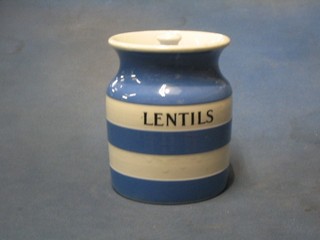 A circular blue and white striped T G Greener Cornish Kitchen ware storage jar marked Lentils, the base with black shield mark (some crazing to the lid)