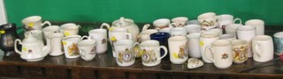 A collection of Coronation mugs, tankards, teapot, sugar bowls, a pomander and a pot and cover etc