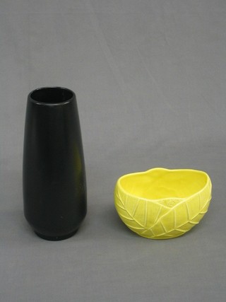 A black glazed Sylvac vase, the base marked 3037 11" and a yellow glazed boat shaped vase marked 2561, 6"