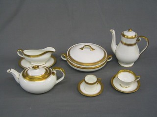 A 57 piece Aynsley Argosy pattern dinner service comprising oval meat plate 14", sauce tureen and stand, 2 twin handled tureens and covers, 6 dinner plates 10 1/2", 6 breakfast plates 8 1/2", 6 tea plates 6 1/2", coffee pot, tea pot, cream jug and sugar bowl, twin handled bread plate 9", 8 twin handled soup bowls, 6 saucers 6 1/2", 6 cups and saucers, 6 coffee cans and saucers 