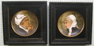 A pair of 19th Century porcelain plates depicting ladies 9", contained in ebonised frames