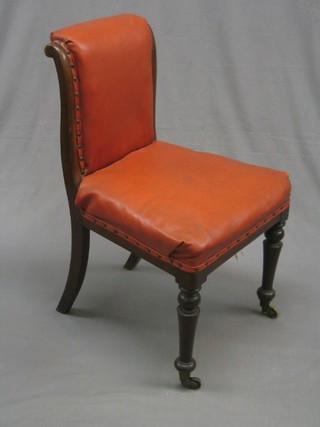 A William IV mahogany show frame standard chair, on turned supports ending in brass caps and castors