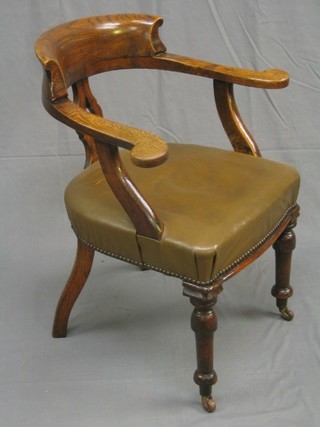 A Victorian elm tub back desk chair with pierced vase splat back and upholstered seat, on turned supports