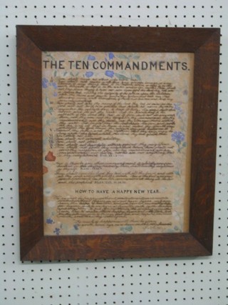 A hand written framed copy of the Ten Commandments with How to Have a Happy New Year 15" x 12" contained in an oak frame