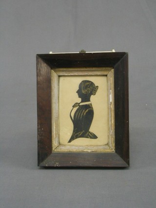 A 19th Century silhouette of a standing lady contained in a rosewood frame 4" x 3"
