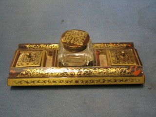 A 19th Century French rectangular red boulle standish, having cut glass inkwell to the centre, flanked by a pair of stamp boxes with lidded covers and with 2 pen recepticals to the side 9 1/2"