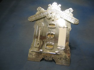 A 19th/20th Century pierced Russian silver perpetual calendar in the form of a house incorporating thermometer, aide memoir, day, date and month aperture, engraved From The Englishmen at The Russian Cotton Mill 1894-1906, 13", together with a propelling pencil