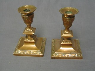 A pair of Edwardian embossed silver plated Adam style stub candlesticks (plate worn)