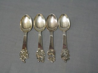 4 "Dutch" silver teaspoons decorated figures