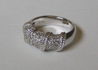 A lady's 18ct white gold twist dress ring set numerous diamonds