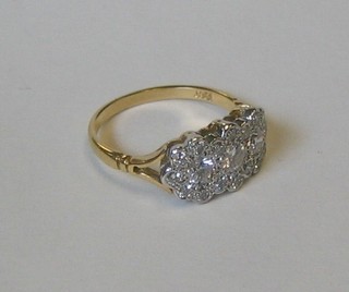 A lady's 18ct yellow gold triple cluster dress ring set numerous diamonds (approx 1ct)