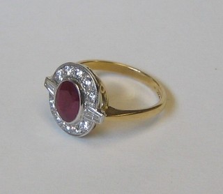 A lady's 18ct yellow gold ring set a pink oval cut sapphire supported by 2 baguette cut diamonds and surrounded by 10 diamonds (approx 0.60/1.63ct)