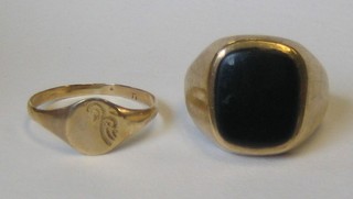A gentleman's 9ct gold signet ring and a lady's signet ring