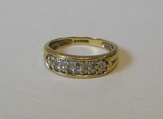 A lady's 18ct gold gold dress ring set numerous diamonds