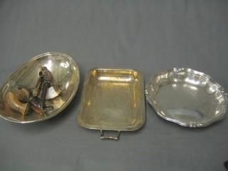 A silver plated twin handled entree dish lid, a circular silver plated dish, a boat shaped bowl and a collection of 4 old pipes