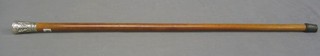 A Melacca cane with embossed Eastern handle