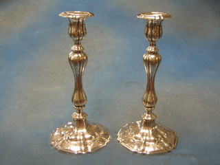 An impressive pair of Victorian engraved silver plated Rococo style candlesticks 11"