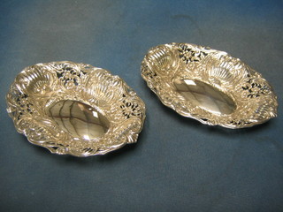 A pair of Victorian embossed and pierced silver oval dishes, Birmingham 1887, 10zs